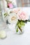 Wedding table decoration series - pink and white bouquet of flowers in clear glass vases