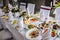 Wedding table, food, drinks, water. Table with silver and glass stemware at restaurant before starting to celebrate a wedding..