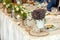 Wedding table with meal and decorative coach