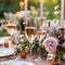 Wedding table setting with glasses of rose champagne, roses and candles. Romantic wedding illustration with glasses of sparkling
