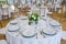 Wedding tables are set for fine dining at a fancy catered event - wedding table series