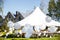 Wedding tent with large balls. Tables sets for wedding or another catered event dinner