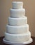 Wedding Theme, Finely detailed multi-tiered intricate completely white only wedding cake, detailed shapes decoration