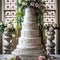 Wedding Theme, Large Modern style multi-tiered intricate wedding cake, detailed motif with large flower arrangement on top