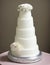 Wedding Theme, Modern style simplistic multi-tiered wedding cake with white and soft peach color rose with green leaves decoration