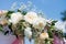 Wedding tradition arch with flower decor on blue sky background