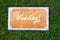 Wedding wooden sign on the grass