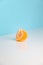 Wedges of tangerine on white table. Minimalistic image of piece