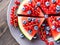 Wedges of watermelon cake with summer berries