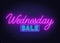 Wednesday Sale neon sign on brick wall background.