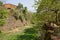 Weedy riverway in deserted boiler factory