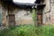 Weedy yard of ruined Chinese dwelling house