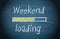 Weekend loading, blue chalkboard with text