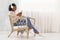 Weekend Relax. Beautiful Black Girl Relaxing In Armchair, Listening Music On Smartphone