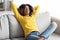 Weekend Relax. Portrait Of Calm Black Woman Resting On Couch At Home