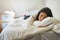 Weekends are meant to be spent in bed. Portrait of a young woman relaxing on her bed at home.