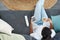 Weekends are for unwinding. High angle shot of a young woman relaxing on the sofa at home.