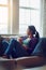 Weekends were made to mellow out. a young woman relaxing on the sofa with a cup of coffee at home.