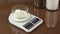 Weigh flour on digital kitchen kitchen.