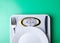 Weighing scale plate fork knife centimeter on green background