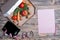 Weight loss and healthy eating concept. Open pizza box with raw vegetables in it, kitchen scales and measuring tape and paper