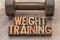 Weight training - word abstract in wood type