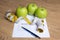 Weightloss concept - close up of paper with diet plan, apples an