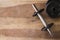 Weights and dumbbell set for fitness on a wooden background