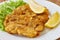 Weiner schnitzel with green salad and lemon