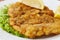 Weiner schnitzel with green salad and lemon