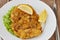 Weiner schnitzel with green salad and lemon