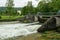 Weir on the river Schwarza in Reichenau on a cloudy day in summer