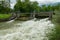 Weir on the river Schwarza in Reichenau on a cloudy day in summer