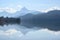 Weissensee, idyllic lake in dusty morning light front of the blue mountains of the bavarian alps near fÃ¼ssen in the allgÃ¤u,