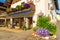 WEISSENSEE LAKE, AUSTRIA - JUL 6, 2015: entrance to guest house decorated with flowers on shore of Weissensee lake in summer