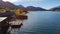 Weissensee - A small cottage at the side of the lake with the mountain view