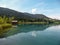 Weissensee - A small cottage at the side of the lake with the mountain view