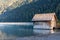 Weissensee - Wooden bathing house at east bank of alpine lake Weissensee in Gailtal Alps, Carinthia, Austria