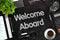 Welcome Aboard - Text on Black Chalkboard. 3D Rendering.