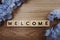 Welcome alphabet letter with space copy on wooden background