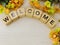 Welcome alphabet letters with cosmos flower bouquet