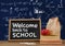 Welcome back to school Desk foreground with blackboard graphics of math equations