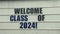 WELCOME CLASS OF 2024 Banner in front of a school welcoming the new students. Admission and registration open for new students.