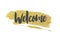 Welcome message on a gold glitter grunge background