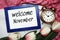 Welcome November written on blue frame with tulip flower flat lay on marble background