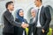 Welcome onboard! Muslim Asian business people shakes hand.