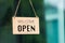 WELCOME WE ARE OPEN PLEASE COME IN notice sign wood board label hanging through glass door