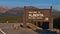 Welcome sign of Canadian province Alberta, the wild rose country, at the border to British Colombia in the evening sunlight.