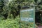 Welcome sign to Bwindi Impenetrable National Park, Southern Sector at Rushaga Gate, noting the gorilla families found on treks