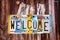 Welcome sign written with recycled license plates